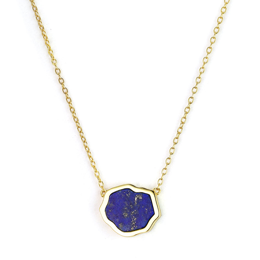 Bright blue lapis gemstone single stone necklace in 14 gold on white background