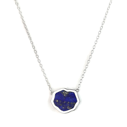 Bright blue lapis gemstone single stone necklace in sterling silver on white background